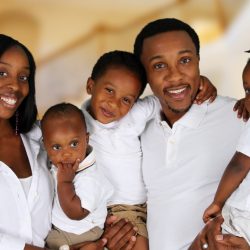 African American family together inside their home