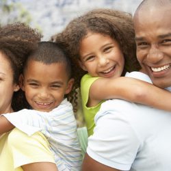 Portrait of Happy Family In Park